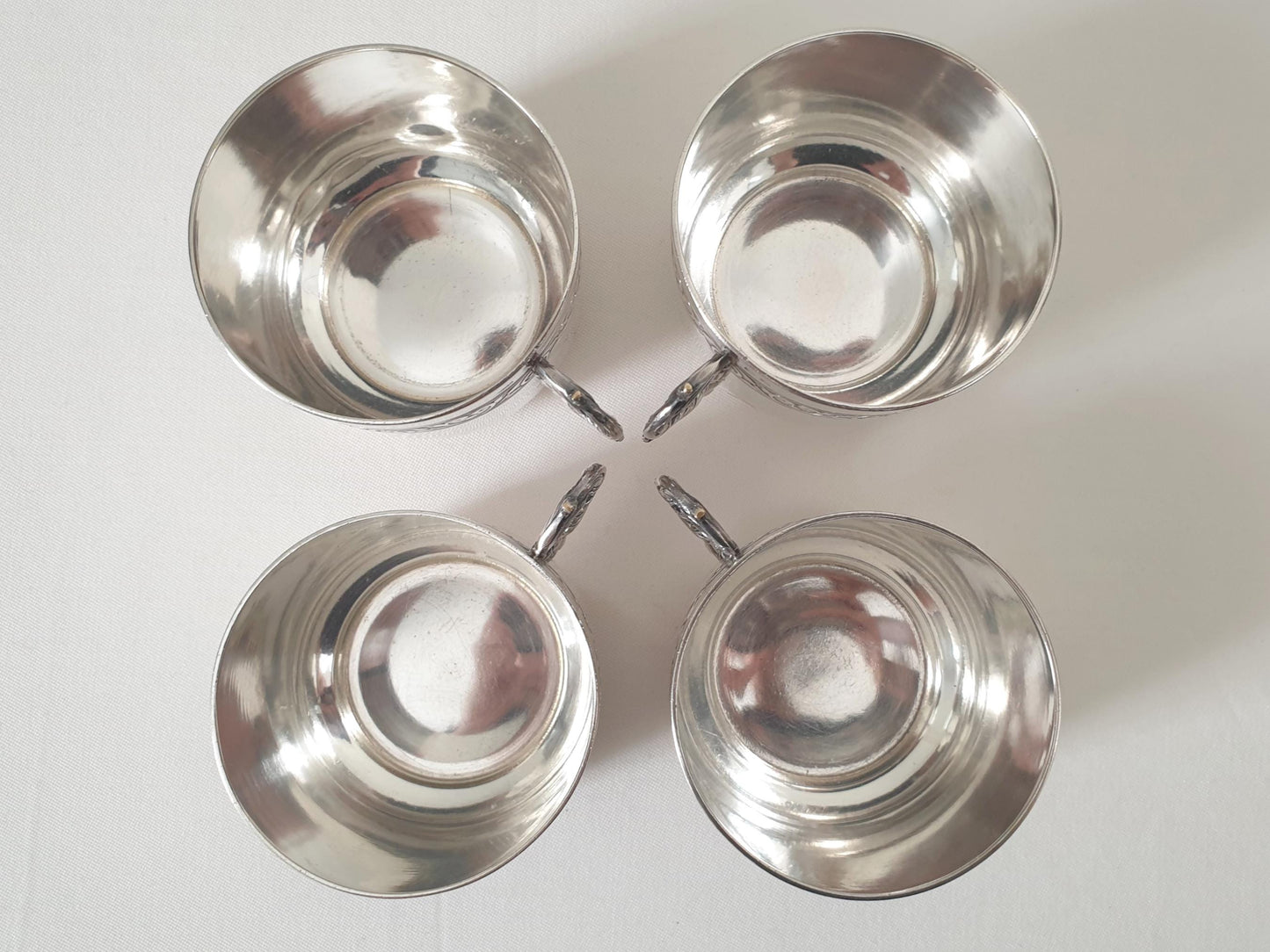 Set of 4 Silver Plated Cups and Saucers with Acanthus Leaf Designed Handles by Denis Gérard, Paris