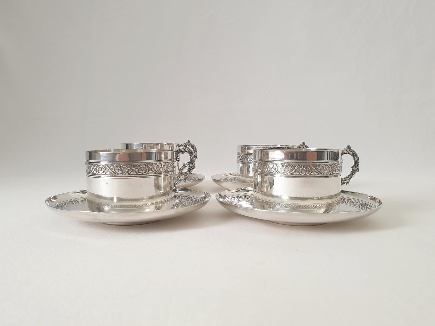 Set of 4 Silver Plated Cups and Saucers with Acanthus Leaf Designed Handles by Denis Gérard, Paris