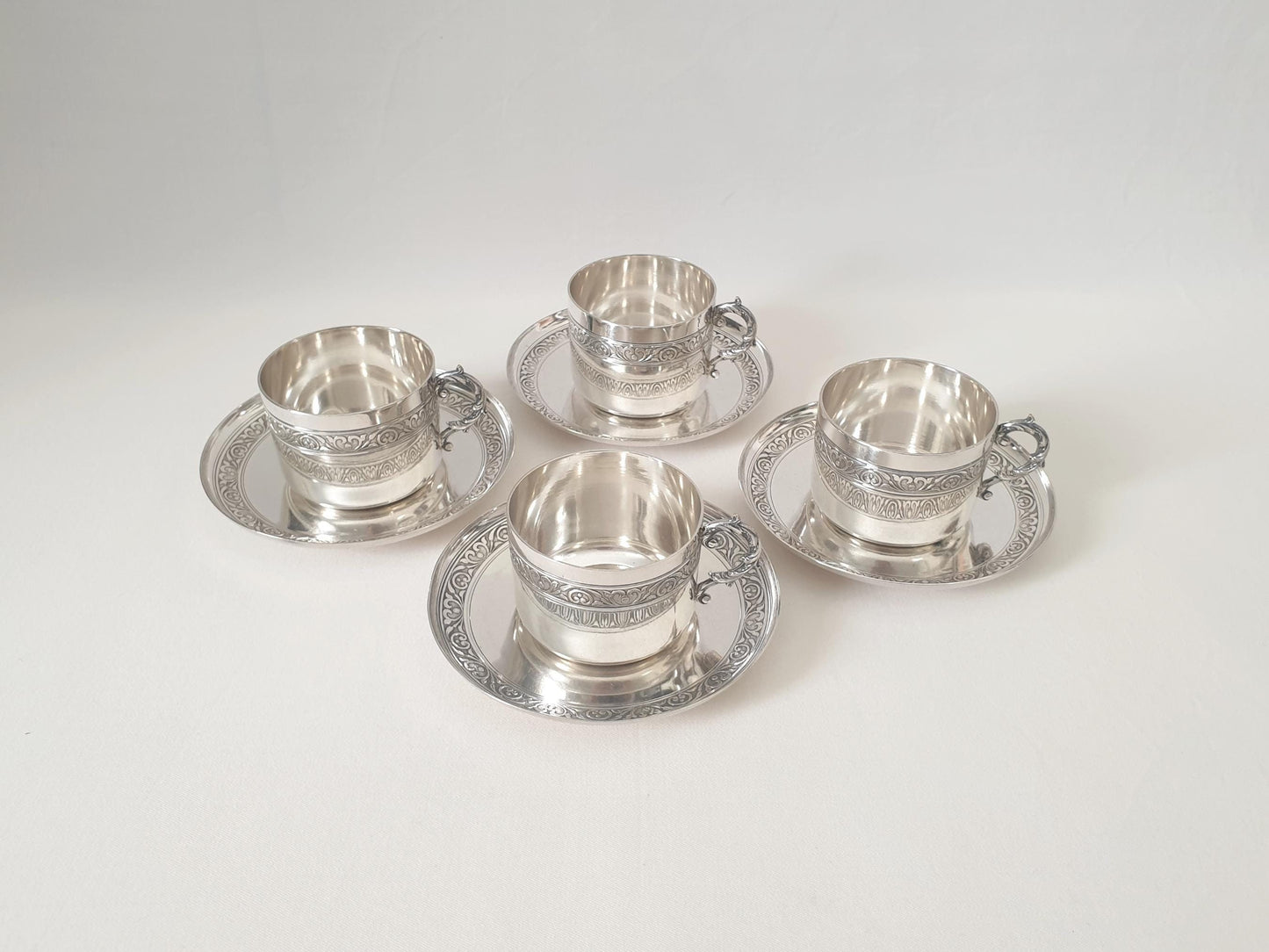 Set of 4 Silver Plated Cups and Saucers with Acanthus Leaf Designed Handles by Denis Gérard, Paris